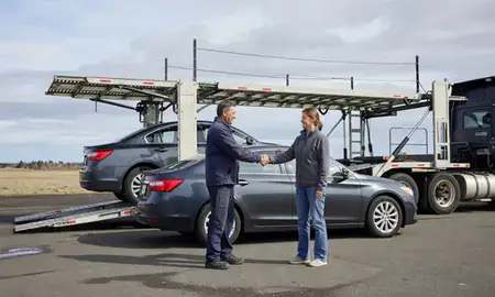 Vehicle owner beside their delivered car in Bellingham, Washington, United States