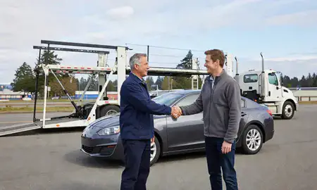 Vehicle owner beside their delivered car in Bremerton, Washington, United States