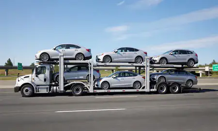 Multi-level car carrier on the highway to Everett, Washington, United States