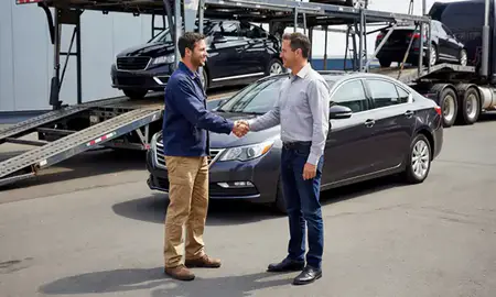 Vehicle owner beside their delivered car in Everett, Washington, United States