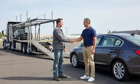 Vehicle owner beside their delivered car in Kennewick, Washington, United States