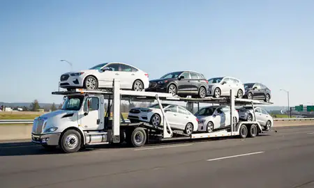 Multi-level car carrier on the highway to Kirkland, Washington, United States