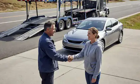 Vehicle owner beside their delivered car in Lacey, Washington, United States