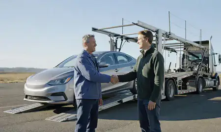 Vehicle owner beside their delivered car in Marysville, Washington, United States
