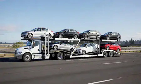 Multi-level car carrier on the highway to Olympia, Washington, United States