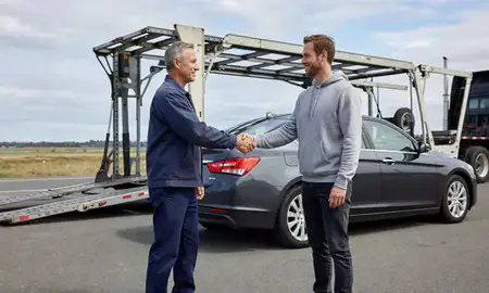 Vehicle owner beside their delivered car in Olympia, Washington, United States