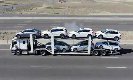 Multi-level car carrier on the highway to Pasco, Washington, United States