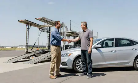 Vehicle owner beside their delivered car in Pasco, Washington, United States