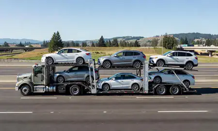 Multi-level car carrier on the highway to Redmond, Washington, United States