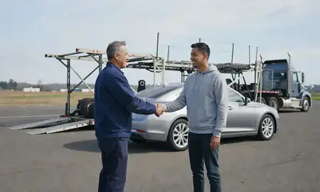 Vehicle owner beside their delivered car in Redmond, Washington, United States