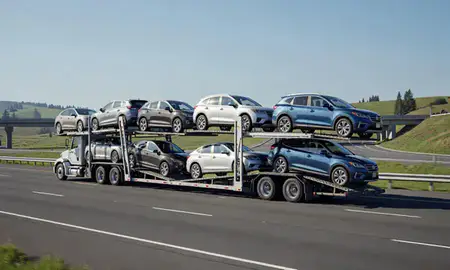 Multi-level car carrier on the highway to Renton, Washington, United States