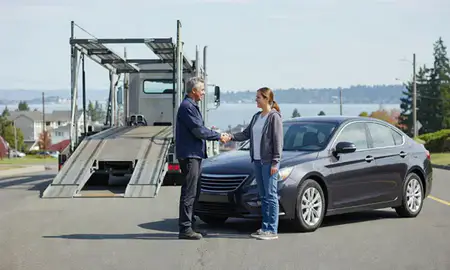Vehicle owner beside their delivered car in Shoreline, Washington, United States