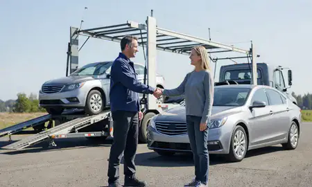 Vehicle owner beside their delivered car in South Hill, Washington, United States