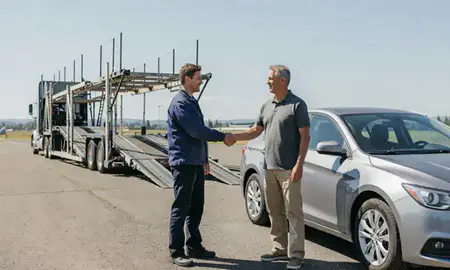 Vehicle owner beside their delivered car in Wenatchee, Washington, United States