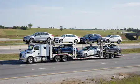 Multi-level car carrier on the highway to Brookhaven, West Virginia, United States