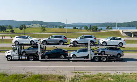 Multi-level car carrier on the highway to Cheat Lake, West Virginia, United States