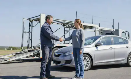 Vehicle owner beside their delivered car in Cross Lanes, West Virginia, United States