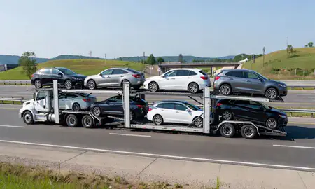 Multi-level car carrier on the highway to Hurricane, West Virginia, United States