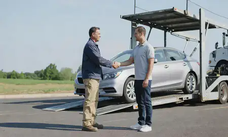 Vehicle owner beside their delivered car in Princeton, West Virginia, United States