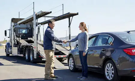 Vehicle owner beside their delivered car in South Charleston, West Virginia, United States