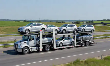 Multi-level car carrier on the highway to St. Albans, West Virginia, United States