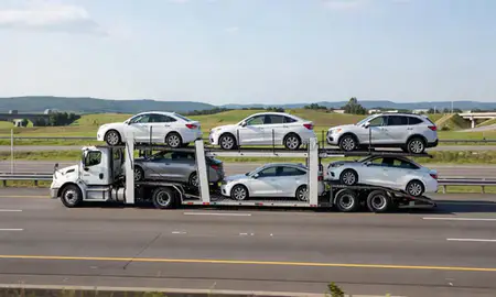 Multi-level car carrier on the highway to Weirton, West Virginia, United States
