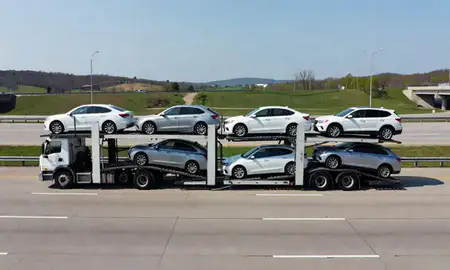 Multi-level car carrier on the highway to Wheeling, West Virginia, United States