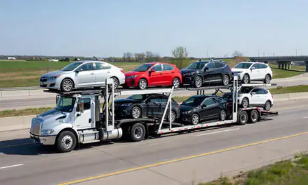 Multi-level car carrier on the highway to Beloit, Wisconsin, United States