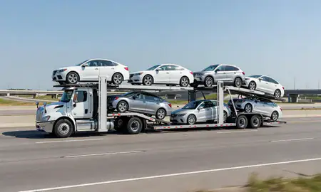 Multi-level car carrier on the highway to Brookfield, Wisconsin, United States