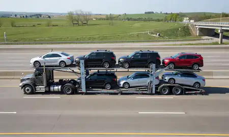 Multi-level car carrier on the highway to Eau Claire, Wisconsin, United States