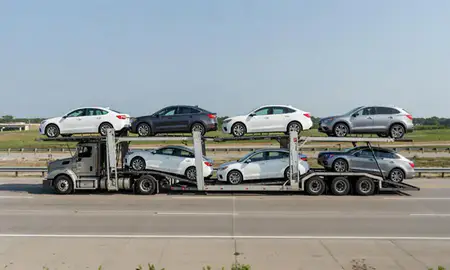 Multi-level car carrier on the highway to Franklin, Wisconsin, United States