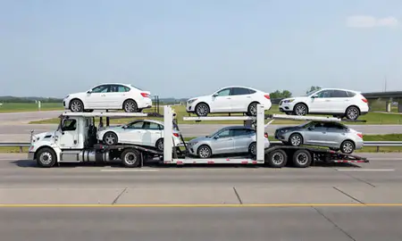Multi-level car carrier on the highway to Greenfield, Wisconsin, United States