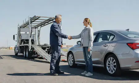 Vehicle owner beside their delivered car in Janesville, Wisconsin, United States