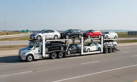 Multi-level car carrier on the highway to Kenosha, Wisconsin, United States