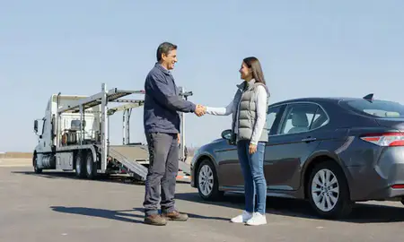 Vehicle owner beside their delivered car in Kenosha, Wisconsin, United States