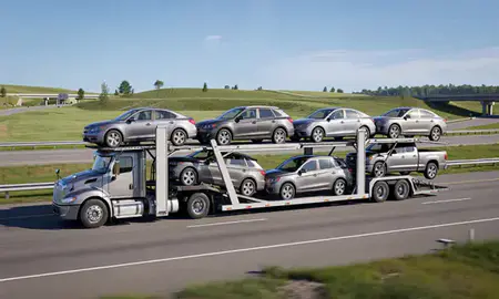 Multi-level car carrier on the highway to Madison, Wisconsin, United States