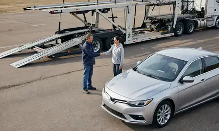 Vehicle owner beside their delivered car in Manitowoc, Wisconsin, United States
