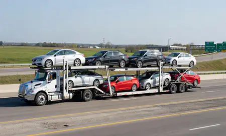 Multi-level car carrier on the highway to Milwaukee, Wisconsin, United States