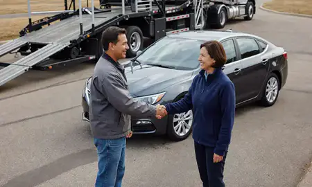 Vehicle owner beside their delivered car in New Berlin, Wisconsin, United States