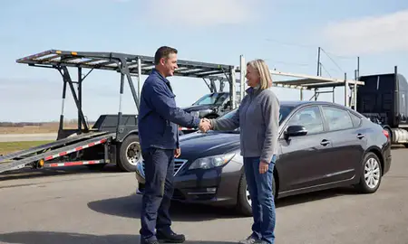 Vehicle owner beside their delivered car in Sheboygan, Wisconsin, United States