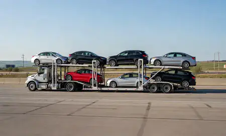 Multi-level car carrier on the highway to Superior, Wisconsin, United States