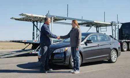 Vehicle owner beside their delivered car in Superior, Wisconsin, United States