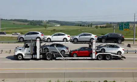 Multi-level car carrier on the highway to Waukesha, Wisconsin, United States
