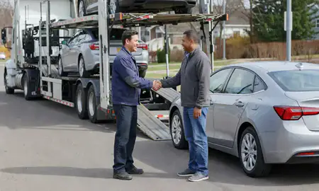 Vehicle owner beside their delivered car in Wauwatosa, Wisconsin, United States