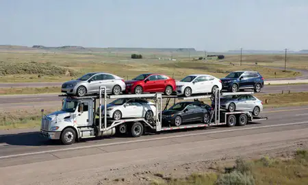 Multi-level car carrier on the highway to Wyoming, United States