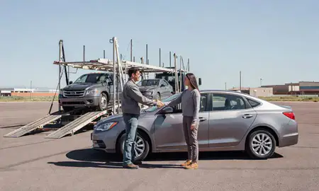 Vehicle owner beside their delivered car in Casper, Wyoming, United States