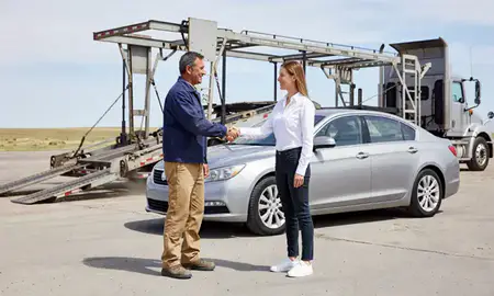Vehicle owner beside their delivered car in Cheyenne, Wyoming, United States