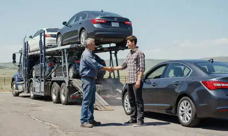 Vehicle owner beside their delivered car in Cody, Wyoming, United States