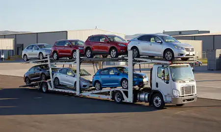 Car transporter loaded with vehicles in Cody, Wyoming, United States