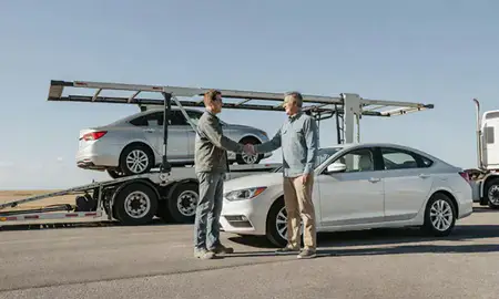 Vehicle owner beside their delivered car in Douglas, Wyoming, United States